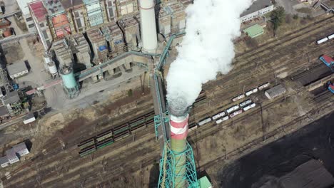 birdseye aerial view, smoke and toxic vapors from coal power plant chimney, air pollution from industry, global warming and climate change concept