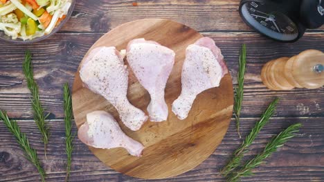 preparing seasoned chicken legs for cooking