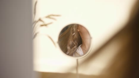 woman looking at herself in a mirror