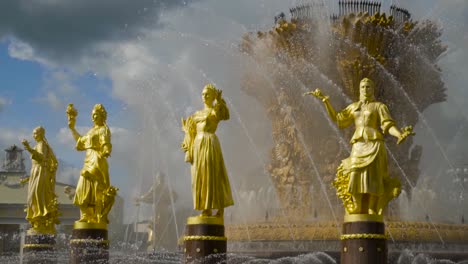 golden statues and water fountain