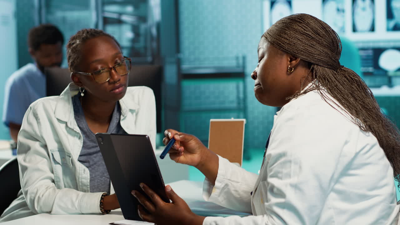 Black specialist providing checkup examination on insurance with patient