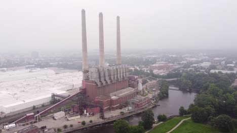 view of otto eckert municipal power plant by the grand river in lansing michigan