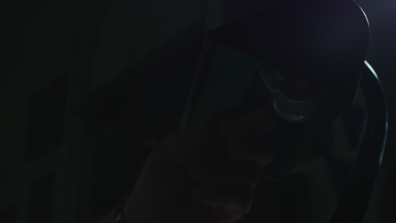 An old man's hand turn on the vintage lamp