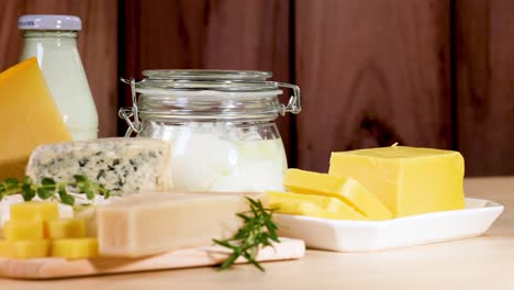 assorted dairy items arranged on a wooden surface