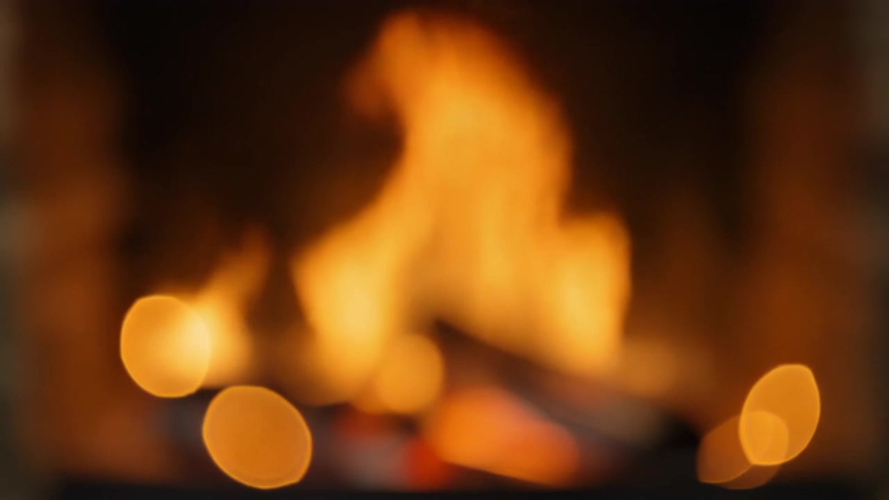 Blurred Flames Burning in a Cozy Fireplace