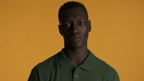 African-american-man-on-yellow-background.