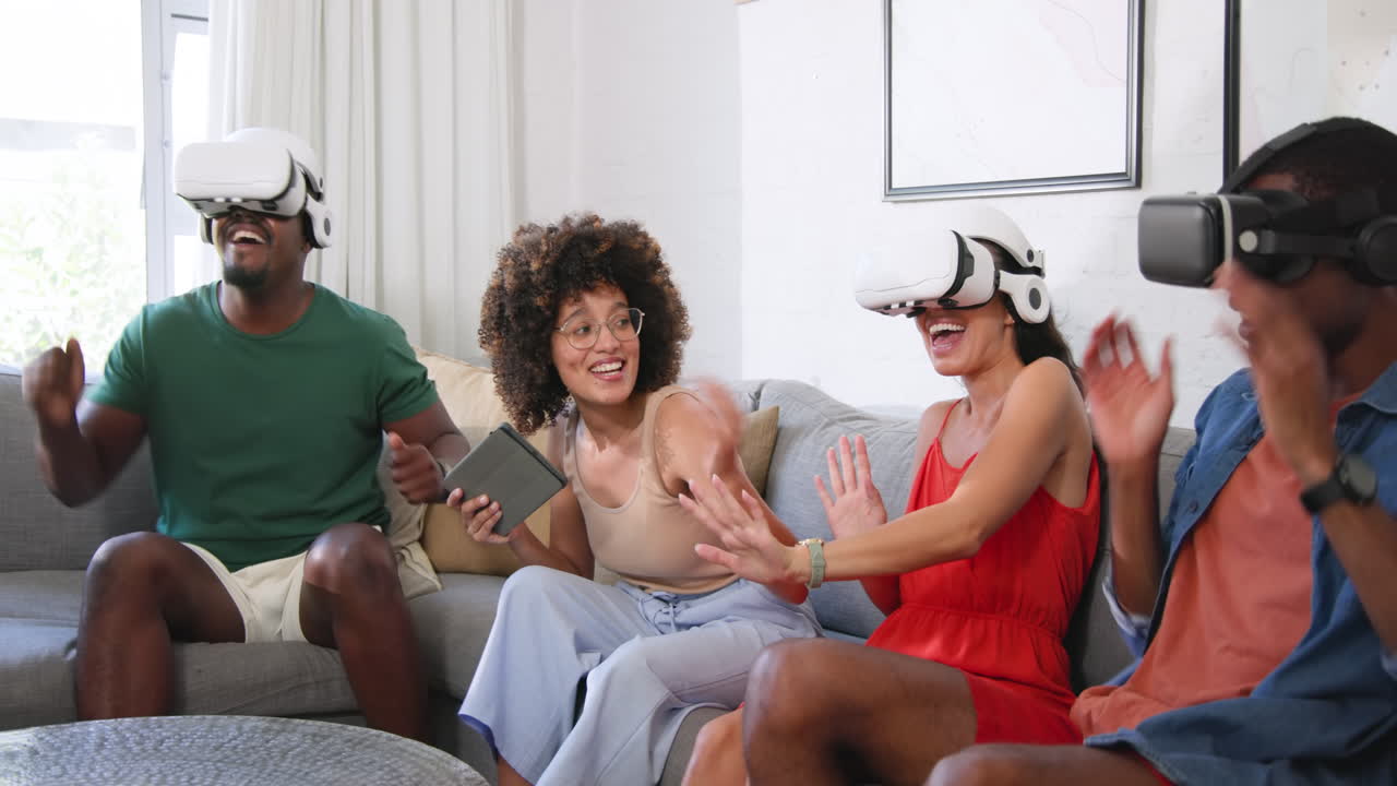 Diverse friends enjoying virtual reality gaming together, wearing VR headsets on couch