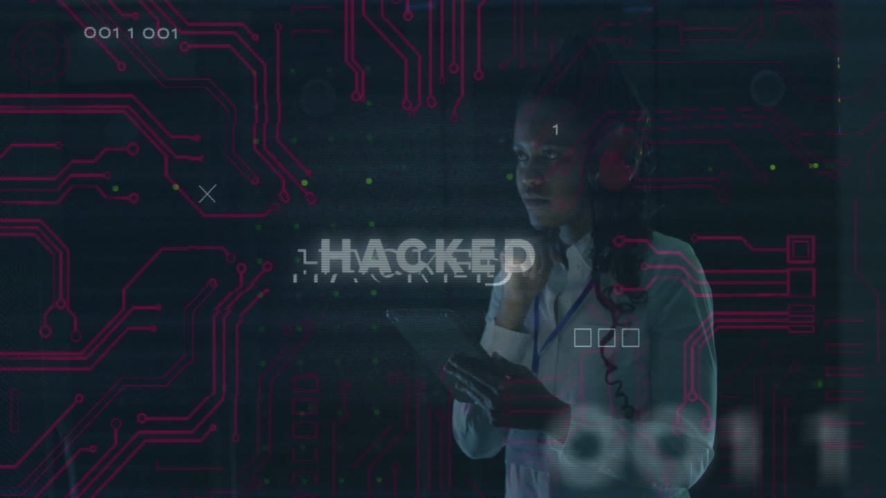 Using tablet, person viewing HACKED text and digital circuit animation