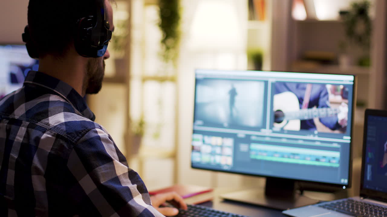 Man working on video editing on a computer