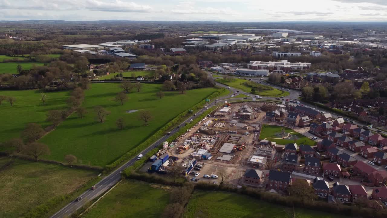 Aerial view of housing development, A534 Road and Crewe taken from Northeast direction - Crewe, Cheshire, UK