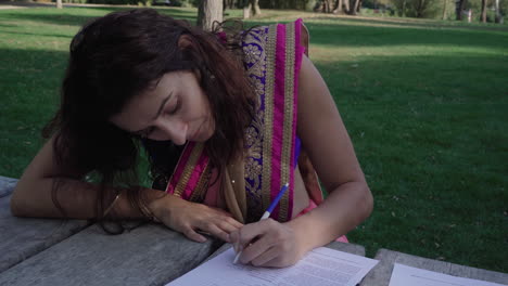 smart girl in saree writing text