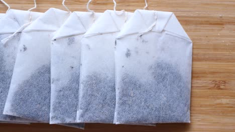 tea bags on wooden cutting board