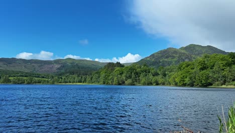 picturesque view of seascape and mountain ridge in scotland. panning shot