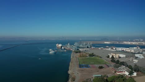 nice pan up and along the shoreline in the urban city near the shore