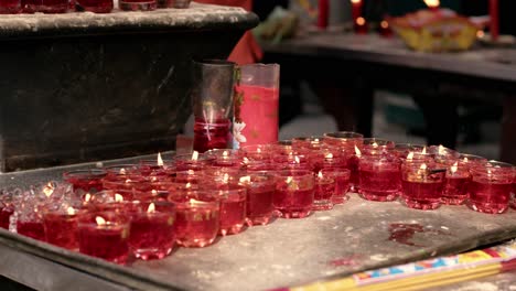 burning candles at an ancient jade emperor pagoda buddhist temple in ho chi minh city, vietnam