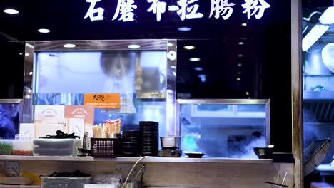 steam rises from a bustling food stall