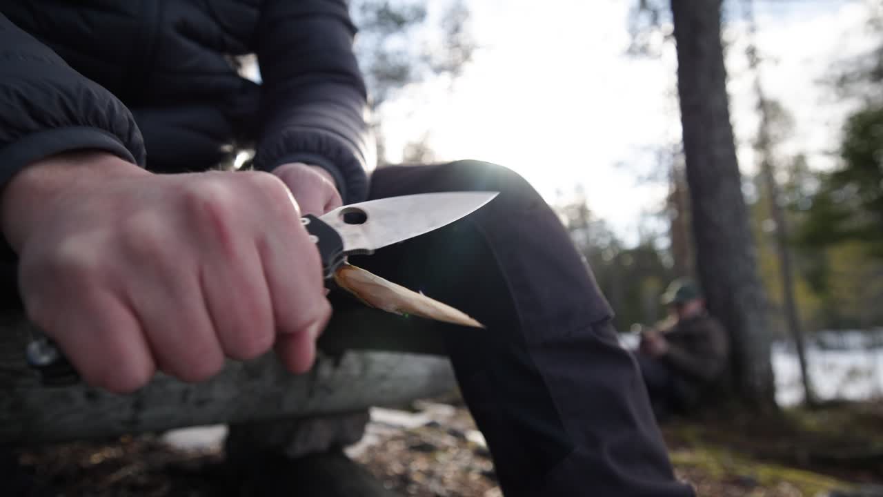 Carving skewer with sharp knife, close-up