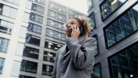 young woman on phone call in a city