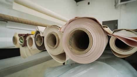 stretch ceilings production at the factory, rolls of fabric