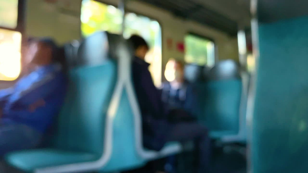 Blurry View Of Passengers Sitting Inside A Moving Tram Wearing Mask In Gdansk, Poland. Social Distancing Observed - defocused
