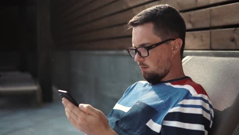 man using a smartphone outdoors