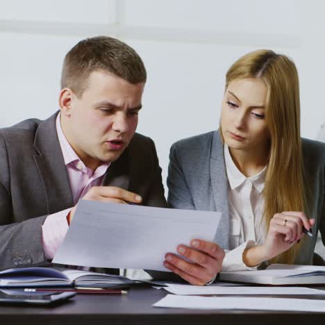 young businessman with assistant in the workplace