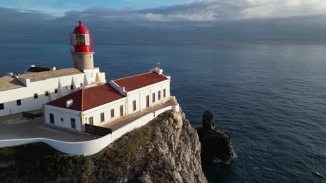 flyover cape st vincent lighthouse on rock cliff above atlantic ocean