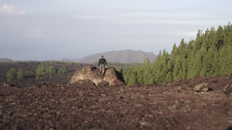 Cheesy-tourist-giving-hands-open-pose-at-Teide-National-park