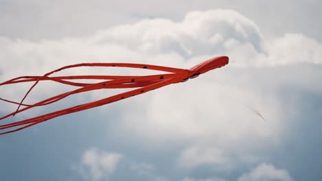 a close-up shot of the red octopus kite floating in the air at the romo kite festival