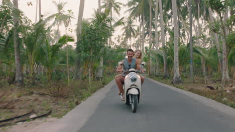 travel couple riding scooter on tropical island enjoying romantic ride exploring beautiful travel destination on motorcycle adventure