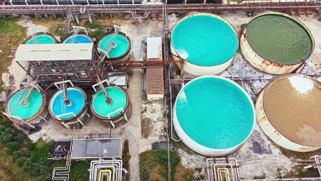 Water treatment facility with large tanks and pipes in operation