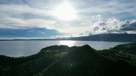 Aerial-of-Forested-Bote-Lighthouse-and-Cabugao-Bay,-Catanduanes,-Philippeans