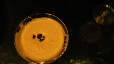 espresso martini with coffee beans in glass