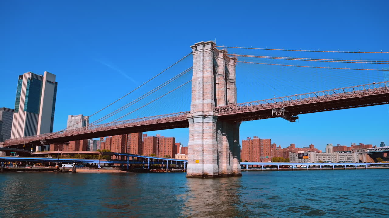 New York, USA, 9 August 2025: Brooklyn Bridge over East River in New York City. A classic view of the Brooklyn Bridge stretching over the East River with Manhattan buildings in the background