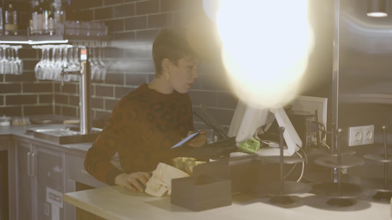 Barista working at a bar counter