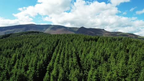 drone rising to reveal the comeragh mountain range waterford ireland on a summer day