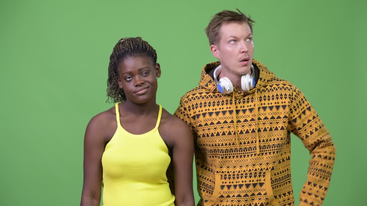 Young multi-ethnic couple looking bored together