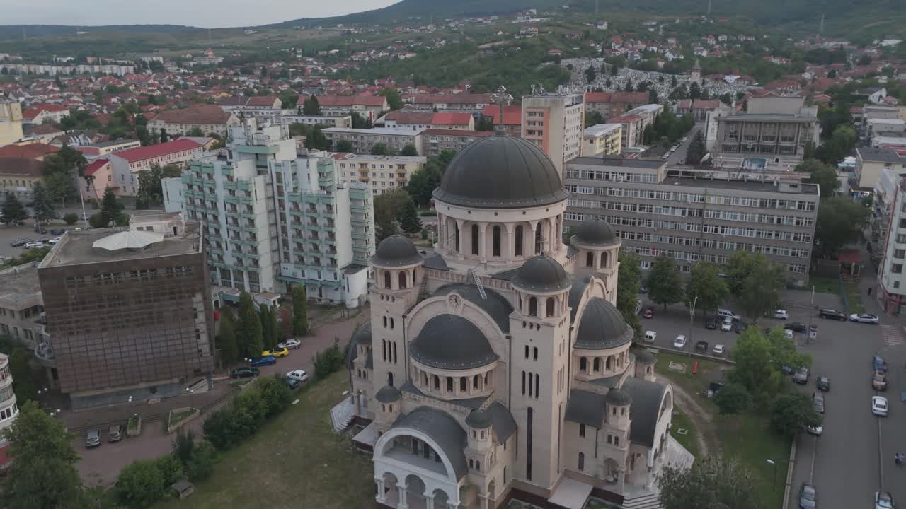 Scenic drone view of Catedrala Adormirea Maicii Domnului with surrounding urban landscape