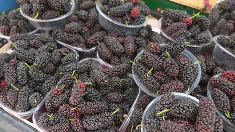 fresh mulberries in plastic containers