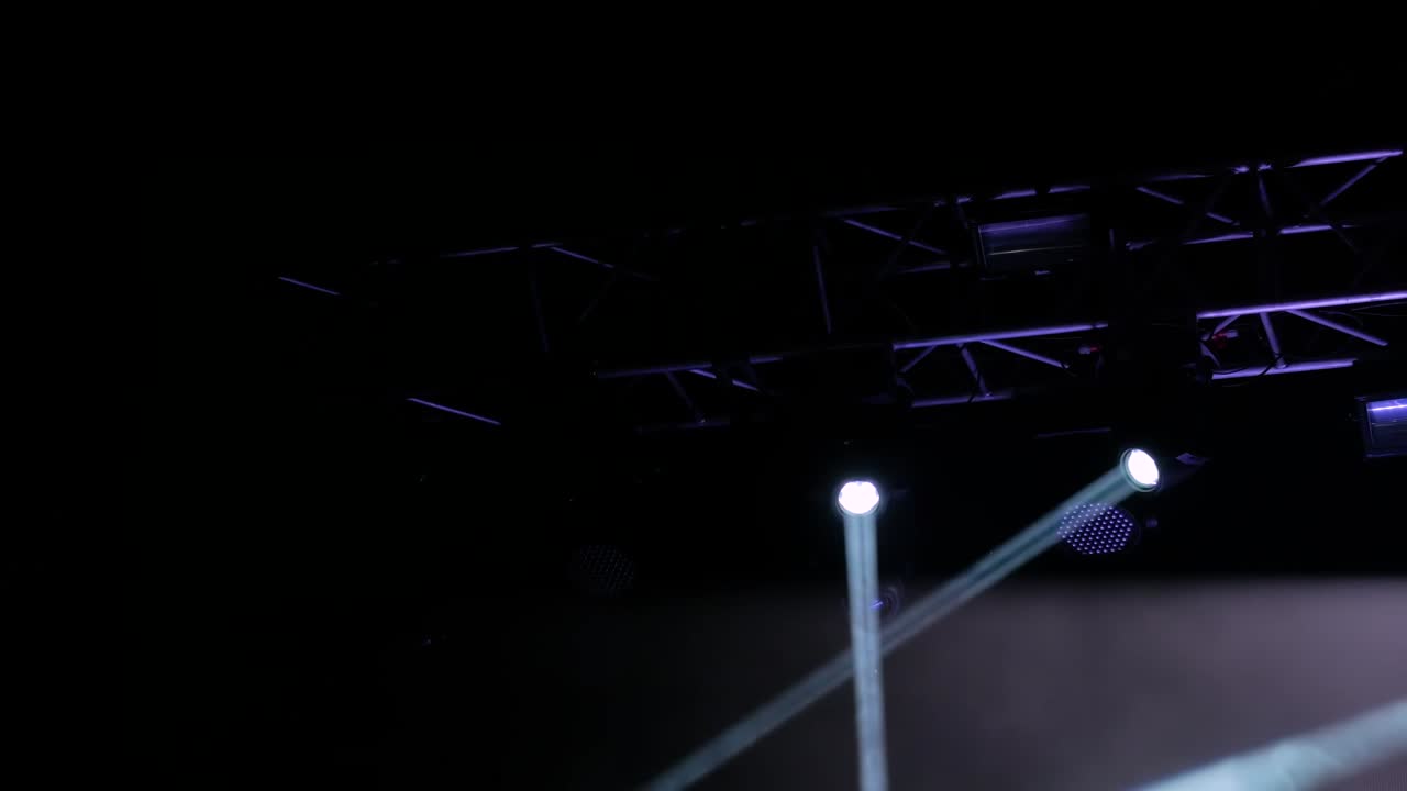 Colorful bright strobing concert lighting equipment for stage at nightclub
