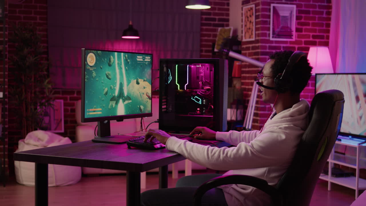 Closeup of african american man streaming online simulation game while talking in headset with team players