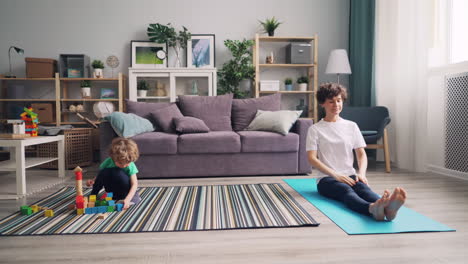 family time: mom and son, play and yoga at home