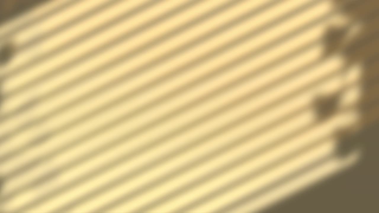 Animation of window shadow of leaves and blinds over yellow background
