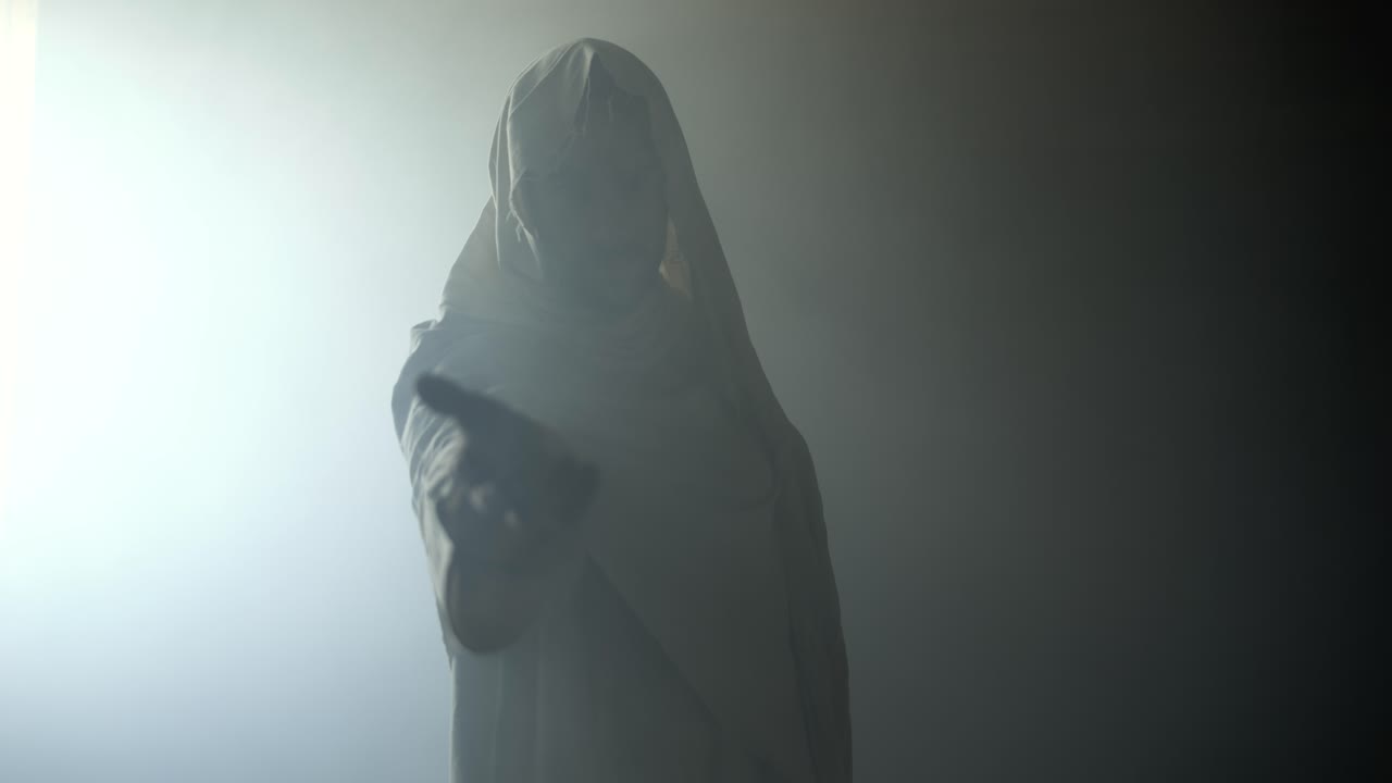 Jesus Christ in glowing, abstract, bright light, offering his hand for help, salvation, love, forgiveness. Cinematic, slow motion Christian visual representation of Easter resurrection and the gospel.