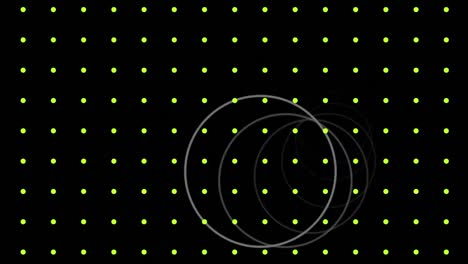 animation of white rings moving over grid of pulsating yellow dots, on black background