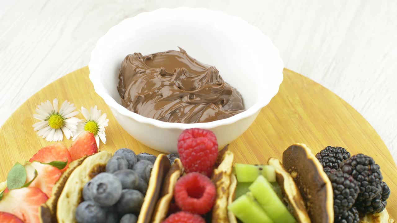 Classic American pancakes with fresh fruits. Summer homemade breakfast.