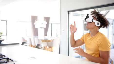 using vr headset, man interacting with virtual environment in modern kitchen, copy space