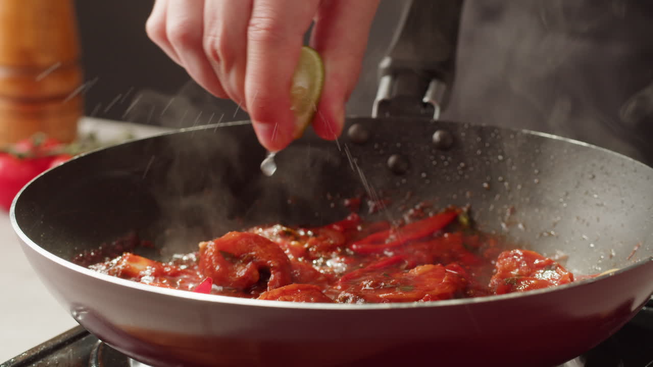 Chef Adding Lime to Shrimp Stir-fry