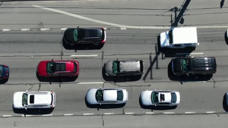 aerial birds eye view directly above three lane highway, stop and go traffic jam congestion