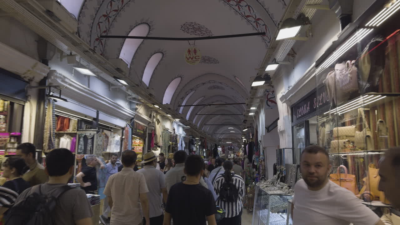 Busy indoor market with people shopping